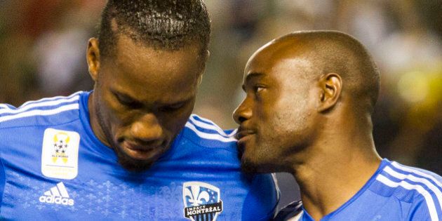 Montreal Impact forward Didier Drogba (11) and midfielder Nigel Reo-Coker (14) in action during an MLS soccer game against Los Angeles Galaxy in Carson, Calif., Saturday, Sept. 12, 2015. (AP Photo/Ringo H.W. Chiu)