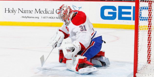 NEWARK, NJ - JANUARY 02: Carey Price #31 of the Montreal Canadiens makes a save against the New Jersey Devils during their game at the Prudential Center on January 2, 2015 in Newark, New Jersey. (Photo by Al Bello/Getty Images)