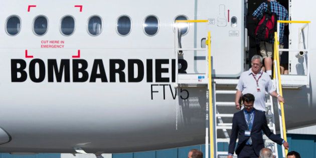 Attendees exit the new Bombardier Inc. CS100 airplane during an event at the company's facility in Toronto, Ontario, Canada, on Thursday, Sept. 10, 2015. Bombardier Inc. is refocusing the sales campaign for its tardy CSeries jet on established, 'marquee' airlines, a shift away from reliance on lessors and small carriers. Photographer: Kevin Van Paassen/Bloomberg via Getty Images
