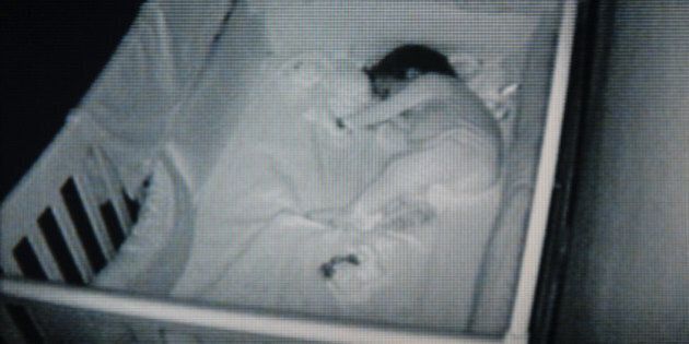 Watching a quiet baby sleeping in his room
