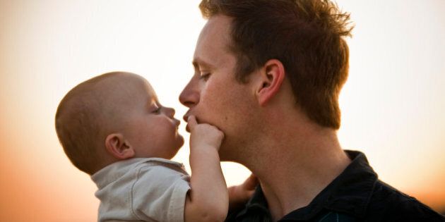 Father Kissing Baby