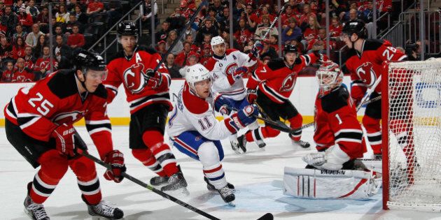NEWARK, NJ - APRIL 03: Brendan Gallagher #11 of the Montreal Canadiens is stoped during the first period by Keith Kinkaid #1 of the New Jersey Devils at the Prudential Center on April 3, 2015 in Newark, New Jersey. (Photo by Bruce Bennett/Getty Images)