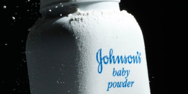 FILE - In this April 19, 2010 file photo, Johnson's Baby Powder is squeezed from its container to illustrate the product, in Philadelphia. Health care giant Johnson & Johnson says it eked out a 2 percent increase in profit for its third quarter, even though sales were down slightly.(AP Photo/Matt Rourke, file)