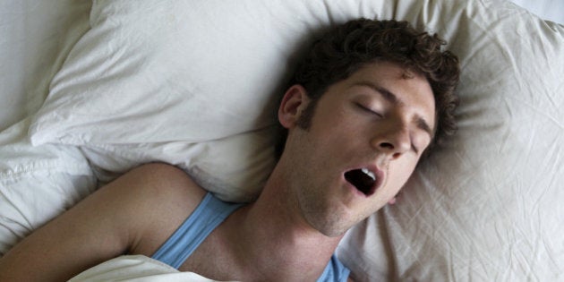 Man sleeping and snoring, overhead view