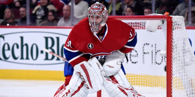 MONTREAL, QC - JANUARY 10: Carey Price #31 of the Montreal Canadiens watches play during the NHL game against the Pittsburgh Penguins at the Bell Centre on January 10, 2015 in Montreal, Quebec, Canada. The Penguins defeated the Canadiens 2-1 in overtime. (Photo by Richard Wolowicz/Getty Images)