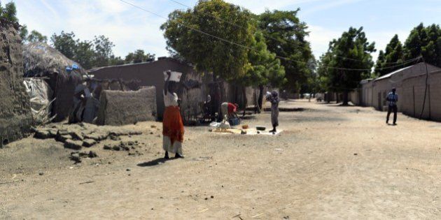 This picture taken on November 12, 2014 in Amchide, northern Cameroon, 1 km from Nigeria shows a street. The city was raided by Islamists from Nigeria's Boko Haram, killing eight cameroonian soldiers and leading the population to flee on October 15, 2014, before another six coordinated attacks that killed at least three civilians in the remote north of the country, on November 9, 2014. Boko Haram's five-year insurgency in neighboring Nigeria has left thousands dead, and the Islamists have occasionally carried out attacks over the border. Cameroon has deployed more than 1,000 soldiers in the extreme northeast of the country to counter the Islamist threat. AFP PHOTO/REINNIER KAZE (Photo credit should read Reinnier KAZE/AFP/Getty Images)