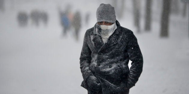 A man walks on Constitution avenue during a major storm on January 23, 2016 in Washington.A deadly blizzard with bone-chilling winds and potentially record-breaking snowfall slammed the eastern US on January 23, as officials urged millions in the storm's path to seek shelter -- warning the worst is yet to come. US news reports said at least eight people had died by late Friday from causes related to the monster snowstorm, which is expected to last until early Sunday. / AFP / Olivier Douliery (Photo credit should read OLIVIER DOULIERY/AFP/Getty Images)