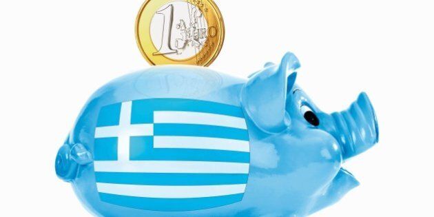 Piggy bank with 1 euro coin and greek flag