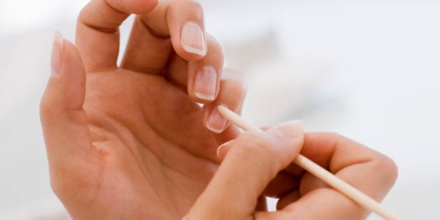 Pushing cuticle of fingernail