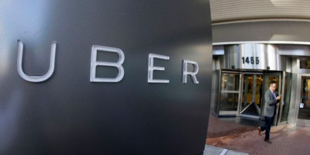 FILE - In this Dec. 16, 2015, file photo, a man leaves the headquarters of Uber in San Francisco. Ride-hailing company Uber received a complaint about erratic driving by Jason Dalton Saturday night, but says it never could have predicted the violent acts Dalton allegedly committed. Dalton was charged Monday, Feb. 22, 2016, with killing six people in random shootings in Kalamazoo, Mich. (AP Photo/Eric Risberg, File)