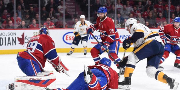 MONTREAL, QC - FEBRUARY 22: Mike Condon #39, Andrei Markov #79 and P.K. Subban; of the Montreal Canadiens defend the goal against Craig Smith #15 of the Nashville Predators in the NHL game at the Bell Centre on February 22, 2016 in Montreal, Quebec, Canada. (Photo by Francois Lacasse/NHLI via Getty Images)