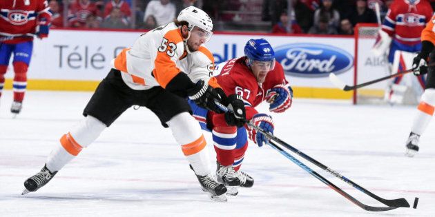 MONTREAL, QC - FEBRUARY 19: Shayne Gostisbehere #53 of the Philadelphia Flyers controls the puck against Max Pacioretty #67 of the Montreal Canadiens in the NHL game at the Bell Centre on February 19, 2016 in Montreal, Quebec, Canada. (Photo by Francois Lacasse/NHLI via Getty Images)