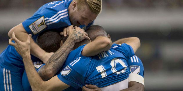 Canada's Montreal Impact team players celebrate with Ignacio Piatti after he scored against Mexico's America during a CONCACAF Cahmpions league match in Mexico City, Wednesday, April 22, 2015. (AP Photo/Christian Palma)