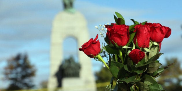 OTTAWA, ON- OCTOBER 23 - Flowers are placed on the barrier near the War Memorial in the aftermath of a shooting in Ottawa, where a soldier murdered at the War Memorial and a gun battle in Parliament killed the alleged gun man. in Ottawa. October 23, 2014. (Steve Russell/Toronto Star via Getty Images)