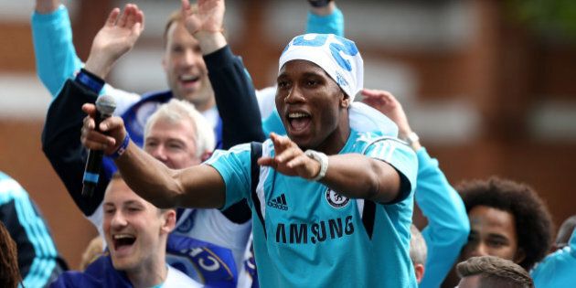 LONDON, ENGLAND - MAY 25: Didier Drogba of Chelsea interacts with the crowd duing the Chelsea FC Premier League Victory Parade on May 25, 2015 in London, England. (Photo by Ben Hoskins/Getty Images)