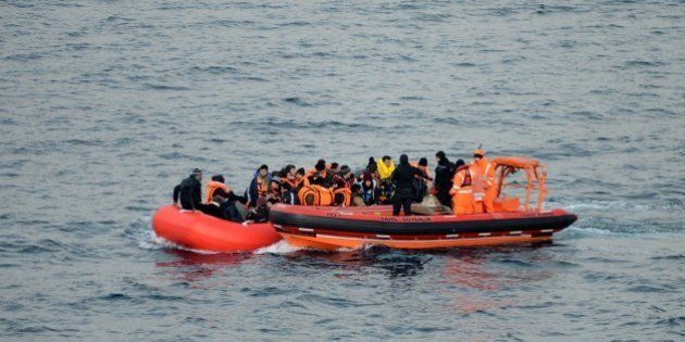 CANAKKALE, TURKEY - FEBRUARY 9: Turkish Coast Guard ship TCSG Umut (Hope) crew members rescue refugees on February 09, 2016 after a total of 54 refugees and asylum seekers were captured in the Aegean Sea, in shores of Canakkale province of Turkey, as they attempted to reach the nearby Greek islands. (Photo by Burak Akay/Anadolu Agency/Getty Images)