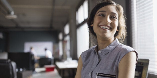 Smiling businesswoman in office