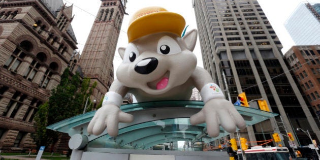 Pachi, the mascot for the Pan Am Games, is displayed on a bus stop in downtown Toronto, Thursday, July 9, 2015. The city will host the games starting with Friday's opening ceremony. (AP Photo/Julio Cortez)