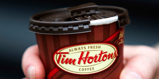 A cup of Tim Hortons Inc. coffee is displayed for a photograph in Toronto, Ontario, Canada, on Wednesday, Aug. 3, 2011. Tim Hortons Inc. is a chain of franchise fast food restaurants that serve coffee drinks, tea, soups, sandwiches, donuts, bagels, and pastries. Photographer: Brent Lewin/Bloomberg via Getty Images