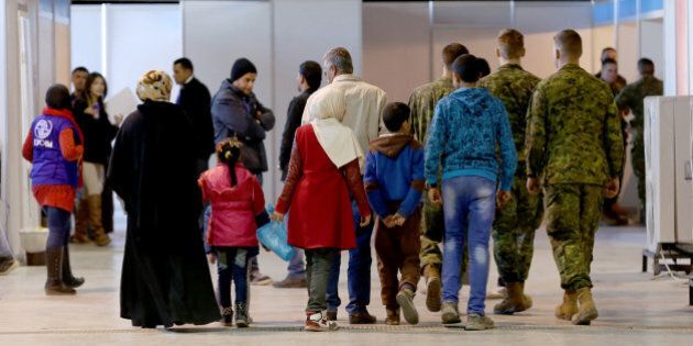 Syrian refugees wait at Marka Airport in Amman, Jordan, on Tuesday, Dec. 8, 2015 to complete their migration procedures to Canada,which has announced that it will take around 25,000 Syrians from Jordan, Lebanon and Turkey. (AP Photo/Raad Adayleh)
