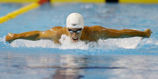 Mauricio Fiol of Peru competes during the finals of the men's 200-meter butterfly swimming event at the Pan Am Games Tuesday, July 14, 2015, in Toronto. Fiol won the silver medal. (AP Photo/Mark Humphrey)