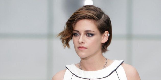 Actress Kristen Stewart poses for photographers as she arrives for Chanel 's Spring-Summer 2015 Haute Couture fashion collection, presented in Paris, France, Tuesday, Jan. 27, 2015. (AP Photo/Thibault Camus)