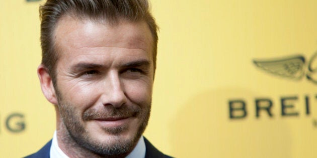 English former footballer David Beckham poses for photographers during a photocall in Madrid, Spain on Wednesday, June 3, 2015. (AP Photo/Abraham Caro Marin)