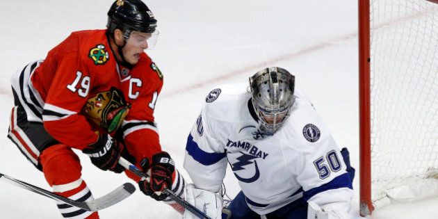 Chicago Blackhawks center Jonathan Toews (19) scores a game winning goal past Tampa Bay Lightning goalie Kristers Gudlevskis during overtime in an NHL hockey game in Chicago, Saturday, Oct. 24, 2015. Chicago won 1-0. (AP Photo/Andrew A. Nelles)