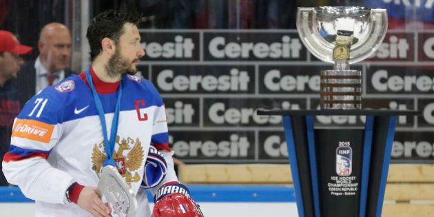 Russiaâs Ilya Kovalchuk looks at the trophy after his team was defeated by Canada in the Hockey World Championships gold medal match in Prague, Czech Republic, Sunday, May 17, 2015. (AP Photo/Petr David Josek)
