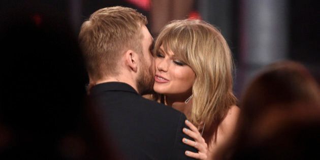 Taylor Swift, right, hugs Calvin Harris after winning the award for top billboard 200 album for â1989â at the Billboard Music Awards at the MGM Grand Garden Arena on Sunday, May 17, 2015, in Las Vegas. (Photo by Chris Pizzello/Invision/AP)