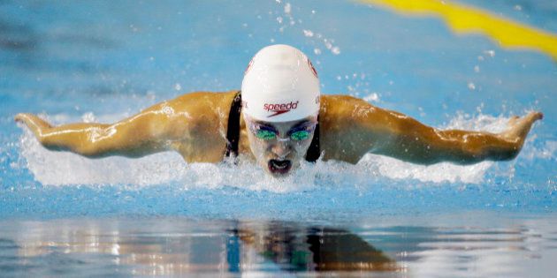 Audrey Lacroix of Canada competes during the finals of the women's 200-meter butterfly swimming event at the Pan Am Games Tuesday, July 14, 2015, in Toronto. Lacroix won the gold medal. (AP Photo/Mark Humphrey)