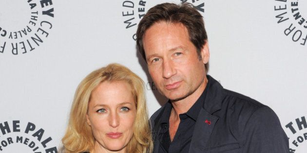 FILE - In this Oct. 12, 2013 file photo, actors Gillian Anderson and David Duchovny attend