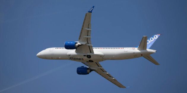 A Bombardier CS300 C Series aircraft, manufactured by Bombardier Inc., performs a flying display on day two of the 51st International Paris Air Show in Paris, France, on Tuesday, June 16, 2015. The 51st International Paris Air Show is the world's largest aviation and space industry exhibition and takes place at Le Bourget airport June 15 - 21. Photographer: Jasper Juinen/Bloomberg via Getty Images
