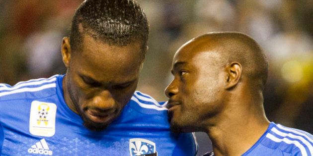 Montreal Impact forward Didier Drogba (11) and midfielder Nigel Reo-Coker (14) in action during an MLS soccer game against Los Angeles Galaxy in Carson, Calif., Saturday, Sept. 12, 2015. (AP Photo/Ringo H.W. Chiu)