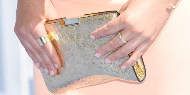 LOS ANGELES, CA - APRIL 12: Actress Stefanie Scott, purse, ring and manicure details, attends The 2015 MTV Movie Awards at Nokia Theatre L.A. Live on April 12, 2015 in Los Angeles, California. (Photo by Michael Buckner/Getty Images)