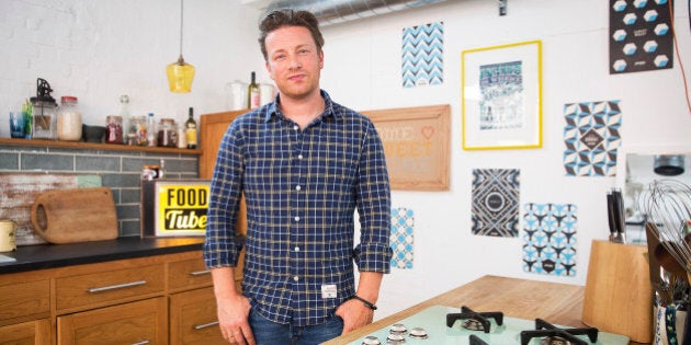 Celebrity Chef Jamie Oliver, restaurateur and media personality, poses for a photograph following an interview at his office in London, U.K., on Monday, June 30, 2014. Oliver has sold more than 30 million cook books, starred in television shows around the world and owns more than 30 restaurants, from London to Sydney. Photographer: Simon Dawson/Bloomberg via Getty Images