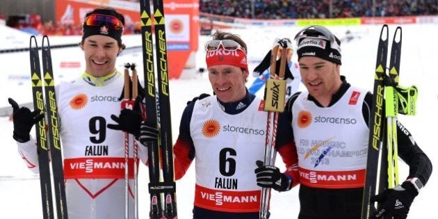 Winner Maxim Vylegzhanin of Russia (C), third placed Alex Harvey of Canada (L) and second placed Dario Cologna of Switzerland react after the men cross-country skiathlon15 km classic and 15 km free race during the 2015 FIS Nordic World Ski Championships in Falun, Sweden, on February 21, 2015. AFP PHOTO / JONATHAN NACKSTRAND (Photo credit should read JONATHAN NACKSTRAND/AFP/Getty Images)