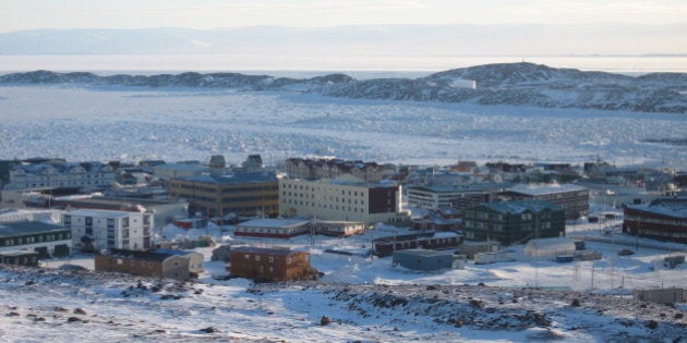 The town of Iqaluit, Nunavut Territory, Canada, about 200 miles (321 kms) south of the Arctic Circle is seen on Monday, Feb. 26, 2007. Iqaluit is the capital of Canada's newest provinces, Nunavut Territory, which was carved out of the Northwest Territories to become a semi-autonomous region in 1999. There are some 7,000 people in Iqaluit, most of whom are Inuit, nomadic hunters who have lived in the frozen climes of Canada, Alaska, Russia and Greenland for thousands of years. The Inuit are the first on earth to experience the impact of global warming and claim the United States is violating their human rights by being the world's largest emitter of greenhouse gases. (AP Photo/Beth Duff-Brown)