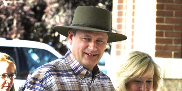 Canadian Prime Minister Stephen Harper and his wife Laureen arrive for the president's dinner at the Calgary Stampede in Calgary, Friday, July 7, 2006. The annual event which lasts 10 days and draws visitors to Calgary from around the world kicked off Friday. (AP PHOTO/CP, Jeff McIntosh)