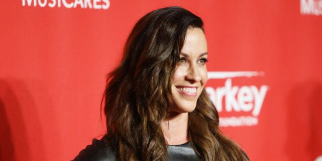 LOS ANGELES, CA - FEBRUARY 06: Alanis Morissette arrives at the 2015 MusiCares Person of The Year honoring Bob Dylan held at Los Angeles Convention Center on February 6, 2015 in Los Angeles, California. (Photo by Michael Tran/FilmMagic)