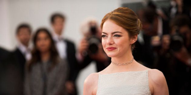 Actress Emma Stone poses for photographers on the red carpet at the screening of the film Irrational Man at the 68th international film festival, Cannes, southern France, Friday, May 15, 2015. (Photo by Arthur Mola/Invision/AP)