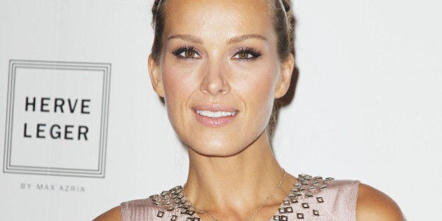 In this image released by Starpix, Petra Nemcova poses at the Herve Leger by Max Azria Spring 2015 show during Fashion Week, Saturday, Sept. 6, 2014, in New York. (AP Photo/Starpix, Amanda Schwab)