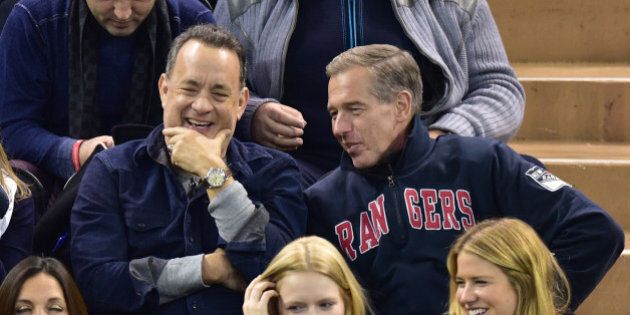 NEW YORK, NY - FEBRUARY 04: Tom Hanks and Brian Williams attend the Boston Bruins vs New York Rangers game at Madison Square Garden on February 4, 2015 in New York City. (Photo by James Devaney/GC Images)