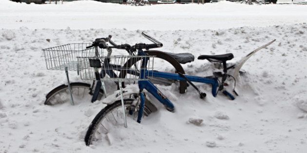 NEW YORK, NY - DECEMBER 27: Bikes are buried underneath a pile of snow on Columbus Avenue on December 27, 2010 in New York City. A blizzard pounded the East Coast of the United States delivering 20 inches of snow to New York City while snarling post-Christmas travel. (Photo by Andrew Burton/Getty Images)