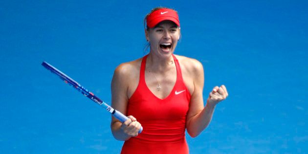 Maria Sharapova of Russia celebrates after defeating her compatriot Ekaterina Makarova in their semifinal match at the Australian Open tennis championship in Melbourne, Australia, Thursday, Jan. 29, 2015. (AP Photo/Vincent Thian)