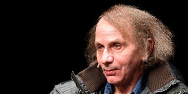 French author Michel Houellebecq presents his new book 'Soumission' ('Submission') before a reading as part of the LitCologne literature festival on January 19, 2015 at Schauspielhaus in Cologne, Germany. 'Soumission', the sixth novel by Houellebecq -- one of France's best-known and most widely translated authors -- deals with a subject matter very likely to stir debate in a France, which is undergoing political and economic turmoil. AFP PHOTO / PATRIK STOLLARZ (Photo credit should read PATRIK STOLLARZ/AFP/Getty Images)