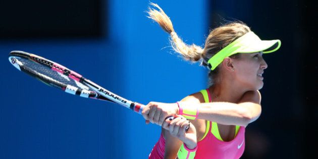 MELBOURNE, AUSTRALIA - JANUARY 23: Eugenie Bouchard of Canada plays a backhand in her third round match against Caroline Garcia of France during day five of the 2015 Australian Open at Melbourne Park on January 23, 2015 in Melbourne, Australia. (Photo by Cameron Spencer/Getty Images)