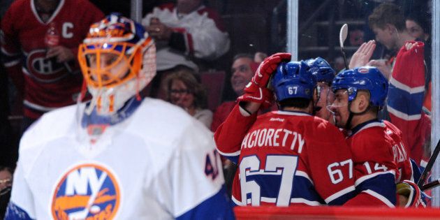MONTREAL, QC - JANUARY 17: Dale Weise #22 of the Montreal Canadiens celebrates his his second period goal with teammates during the NHL game against the New York Islanders at the Bell Centre on January 17, 2015 in Montreal, Quebec, Canada. (Photo by Richard Wolowicz/Getty Images)