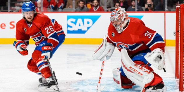 MONTREAL, QC - MAY 01: Jeff Petry #26 and goaltender Carey Price #31 of the Montreal Canadiens watch the puck in Game One of the Eastern Conference Semifinals against the Tampa Bay Lightning during the 2015 NHL Stanley Cup Playoffs at the Bell Centre on May 1, 2015 in Montreal, Quebec, Canada. (Photo by Minas Panagiotakis/Getty Images)