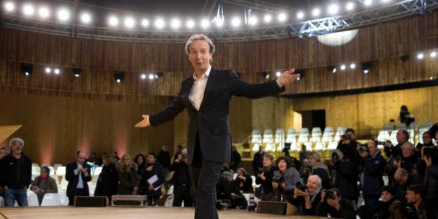 Italian actor Roberto Benigni poses for photographers before the rehearsal of his show